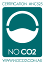 A teal certification badge with a stylized white symbol resembling a face wearing a mask. Text reads Certification #NC525 at the top and NO CO2 at the bottom. The website www.noco2.com.au is displayed at the bottom.