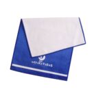 A blue and white towel folded in half diagonally, featuring the text 3 MUSKETEERS with a wrapped candy bar icon above it. A white band is near the towels bottom edge.