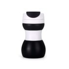 A black and white insulated travel mug with a sleek, curvy design. The mug features a white top and middle section, with black accents at the bottom and near the lid. The lid has a flip-top for easy access.
