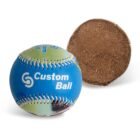 A colorful softball with Custom Ball printed on it is next to a halved cross-section showing its textured brown interior. The ball features green and blue hues with visible stitching.