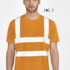 A man wearing an orange T-shirt with reflective white stripes, resembling a safety vest. He stands against a plain background. The logo SOLS is visible above his left shoulder.