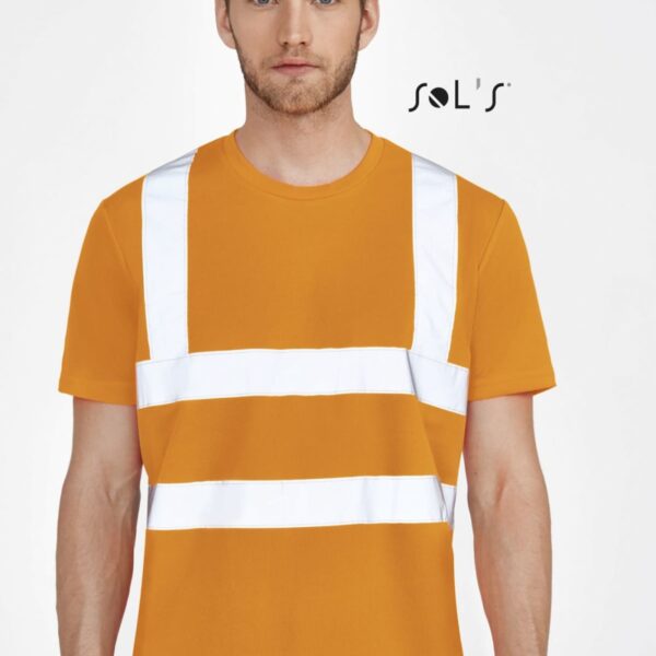 A man wearing an orange T-shirt with white reflective stripes stands against a plain background. The logo SOLS is visible in the top right corner. He has short hair and a trimmed beard.