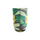 Close-up of a colorful, cylindrical drink koozie with a tropical leaf pattern and yellow panels with text. The seam is visible, running down the center of the koozie.