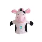 A smiling cow hand puppet with pink ears and a pink snout. It has black and white spots, and a small blue-green circular logo with the word GO on its chest. The puppet is isolated on a plain white background.