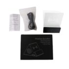 Box contents of a wireless speaker set, including a wireless speaker with a mobile stand, a charging cable in a plastic bag, an instruction manual, and the packaging box displaying product features and a diagram.