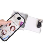 Hand placing an item into an open white safe with a combination lock.