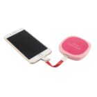 A smartphone connected to a pink, square power bank labeled Mirror Power Bank via a red charging cable. The power bank is compact and portable, suitable for on-the-go charging.
