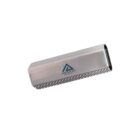 A silver metallic rectangular object with textured edges and a logo that includes a blue triangle and the text AMERICAN. It appears to be a USB brush or similar electronic accessory.
