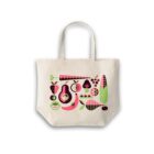 A beige tote bag featuring colorful illustrations of various fruits and vegetables, including a carrot, avocado, lemon, corn, and strawberries. The artwork uses shades of pink, green, and brown.