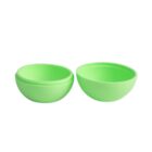Two bright green plastic egg-shaped containers, one open showing its hollow interior.