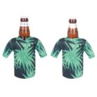 Two beer bottles are each dressed in a green tropical leaf-patterned beverage cooler shaped like a T-shirt. The bottles are uncapped with visible liquid inside, positioned against a plain white background.