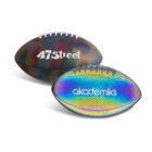 Two footballs with colorful designs. The front one has akademiks written on it in blue, featuring a rainbow mesh pattern. The back football displays 47Street in white, with a multicolored abstract design.