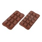 Two brown silicone molds are shown. The left mold features cow-shaped compartments, while the right mold has compartments shaped like cow heads with smiles and horns. Both are used for making cow-themed chocolates or ice cubes.