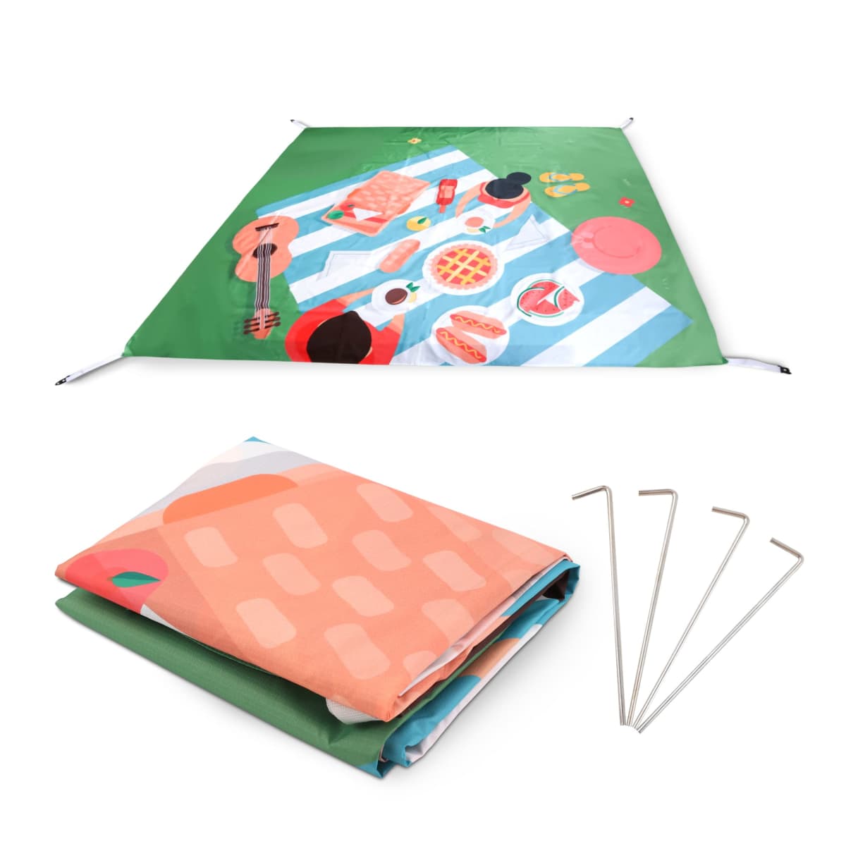 A green picnic blanket with a colorful design featuring food and musical items, laid out flat. Below it, the blanket is folded neatly with four metal stakes beside it. The design includes a guitar, pizza, grapes, and drinks.
