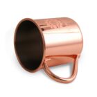 Copper-colored metal mug on its side, showcasing its smooth surface and a sturdy handle. The mugs opening faces left.