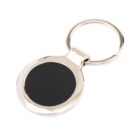 A round metal keychain with a polished silver finish and a black circular insert in the center, attached to a circular keyring.