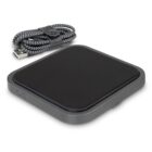 A square black wireless charging pad sits beside a coiled, black and white braided USB cable. The cable is neatly held together with a leather strap.