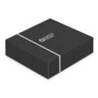 A black Swiss Peak gift box with a shiny silver stripe running across the bottom half, featuring the brand logo and name on the lid. The box is set against a plain white background.