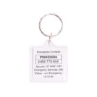 A keychain with a transparent square tag displaying emergency contact numbers, including security, emergency services, and police non-emergency. The tag has a metal keyring attached at the top.