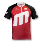Red and black short-sleeve cycling jersey featuring a large white m design on the front. The jersey includes logos and text such as FAST and STUV on the chest, with a partially visible logo on the right shoulder.