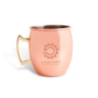 Copper mug with a brass handle, featuring a logo and the text COMPANY YOUR SLOGAN HERE engraved on the side. The mug is set against a white background.