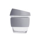 A transparent glass cup with a gray silicone band around its middle and a matching gray lid on top, shown against a white background.
