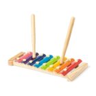 A colorful xylophone with eight metal bars in a rainbow pattern, ranging from red to pink. It is mounted on a wooden frame, and two wooden mallets are resting upright on it.
