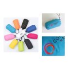 A circle of colorful, compact bags in various colors including orange, blue, and pink around a white bag labeled with a faint logo. The right side shows a close-up of a turquoise bag with a multicolored circular logo.