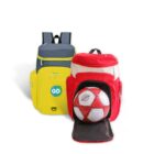 Two colorful backpacks sit side by side. The yellow and gray backpack is on the left, featuring GO on a pocket. The red and white backpack on the right has a soccer ball partially zipped in the front compartment. Both are on a white background.