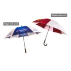 Two umbrellas with different designs. The left umbrella has a blue and white pattern with text. The right umbrella features a red and white striped design. Both have black hooked handles. Labels indicate Single side print and Double side print.