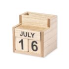 Wooden desk calendar with removable blocks showing the date July 16. The calendar has a simple, natural wood finish with three visible sections: the month at the top and two number blocks below.