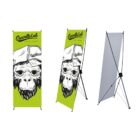 Three views of an X banner stand displaying a design with a monkey wearing a hat that reads Gravity Lab. The background is lime green. The structure shows a visible X frame from behind.