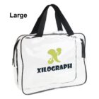 Clear tote bag with black handles, XILOGRAPH logo, and Large text in top left corner.