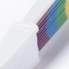 Close-up of a multicolored item with a white plastic component, featuring the embossed text RPET alongside a bottle and recycling symbol, indicating its made from recycled materials.