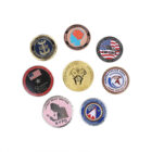 A collection of eight colorful, round challenge coins arranged in a group. Each coin features distinct designs, logos, and inscriptions, some related to police and military themes, including NYPD and USMC.