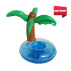 Inflatable cup holder shaped like a blue ring with a palm tree attached. A red label with the word custom is in the top right corner.