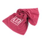 A pink, textured cooling towel is crumpled on a white background. It features a white geometric design resembling a square with additional lines on one side.