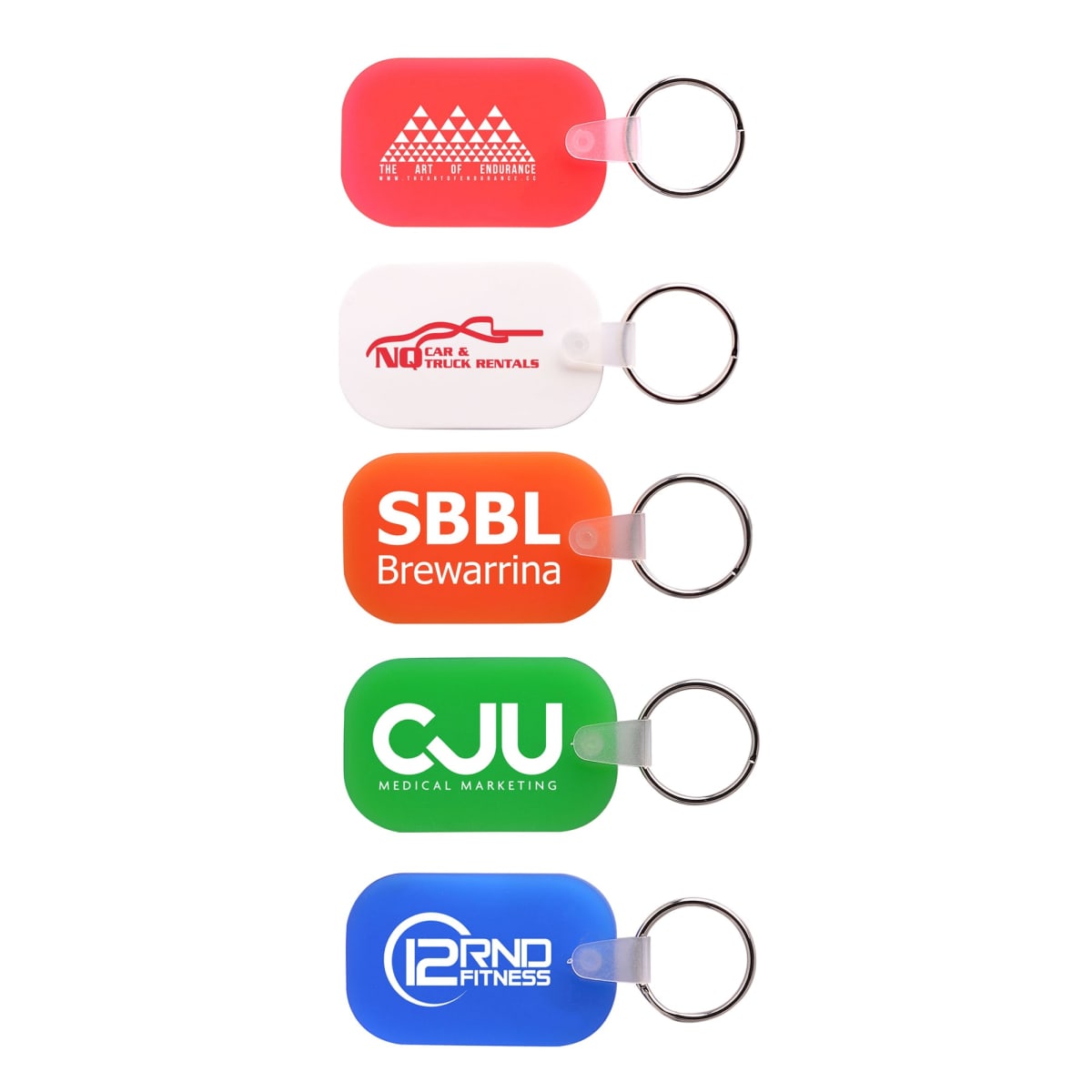 Five keychains with logos: red No Car & Truck Rentals, orange SBBL Brewarrina, green CJU Medical Marketing, and blue 12RND Fitness. Each keychain is rectangular with a metal ring.