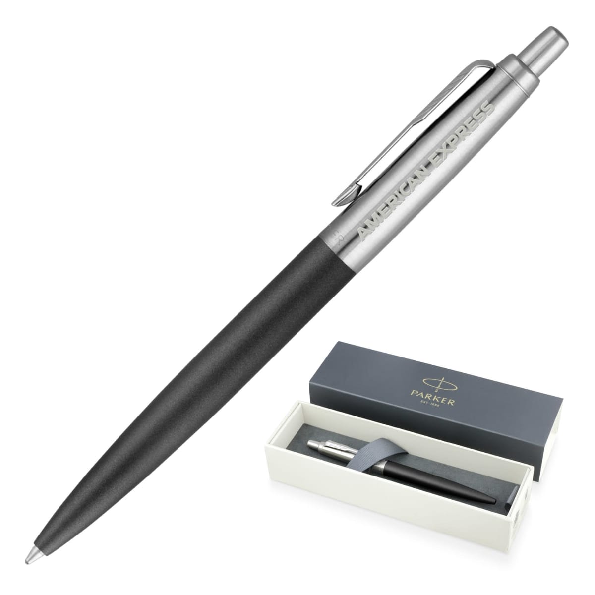 A sleek black and silver ballpoint pen with American Express engraved on the metal clip, displayed next to its open box labeled Parker. The box shows the pen nestled inside on a white lining.