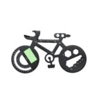 A black multi-tool shaped like a bicycle, featuring various measurement and tool functions on its body, including rulers along the frame, a protractor, and hexagonal cutouts for wrenches.