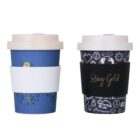 Two reusable coffee cups with lids. The left cup is blue with a white sleeve. The right cup features a dark design with symbols and the phrase Stay Gold on a black sleeve. Both have white lids.