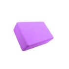 A solid purple yoga block with beveled edges, displayed against a plain white background. The block is positioned at an angle, showcasing its rectangular shape.