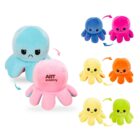 Reversible plush octopus toys in pairs, with one side showing a happy face and the other an angry face. Colors include blue/pink, blue/red, yellow/orange, yellow/green. The pink octopus has ART academy text on it. Arrows indicate reversibility.