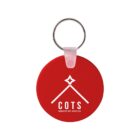 Red circular keyring with a white logo featuring a stylized roof and star. Below, the text reads COTS in bold and Homeless Not Hopeless in smaller font. The ring is silver, and the connecting piece is clear.