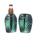 Two beer bottles in zipper neoprene sleeves with green leaf patterns. The sleeves are designed to insulate and fit snugly around the bottles.