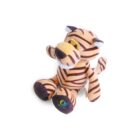 A plush, striped tiger toy with brown and orange colors sits upright. It has a friendly expression, with detailed eyes and a small snout. Its fluffy tail curls slightly, and a small label is attached to one foot. The background is white.