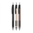 Three retractable ballpoint pens are lined up vertically against a white background. The pens have silver tips and plastic clips, and the barrels are colored black, silver, and brown, from left to right.