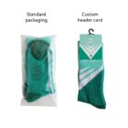 Two green socks are displayed. The left sock is in standard clear plastic packaging. The right sock has a custom header card with a hanger, displaying branding and the word Sport. Both packages show the same sock design with white accents.