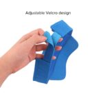 Hand holding a blue item with adjustable Velcro straps.