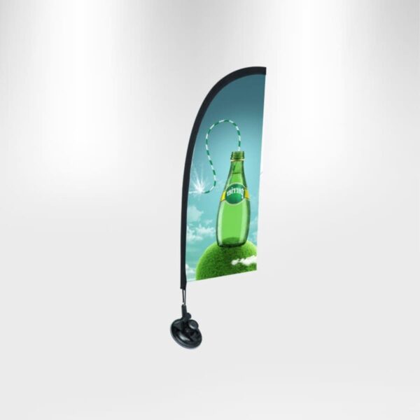 Freestanding display banner featuring a green glass bottle with a striped straw, resting on a grassy hill with dandelions against a blue sky. The banner has a curved top edge and a round base for support.